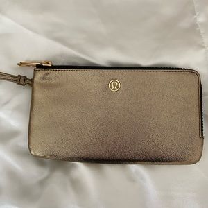 LULULEMON gold wristlet never been used